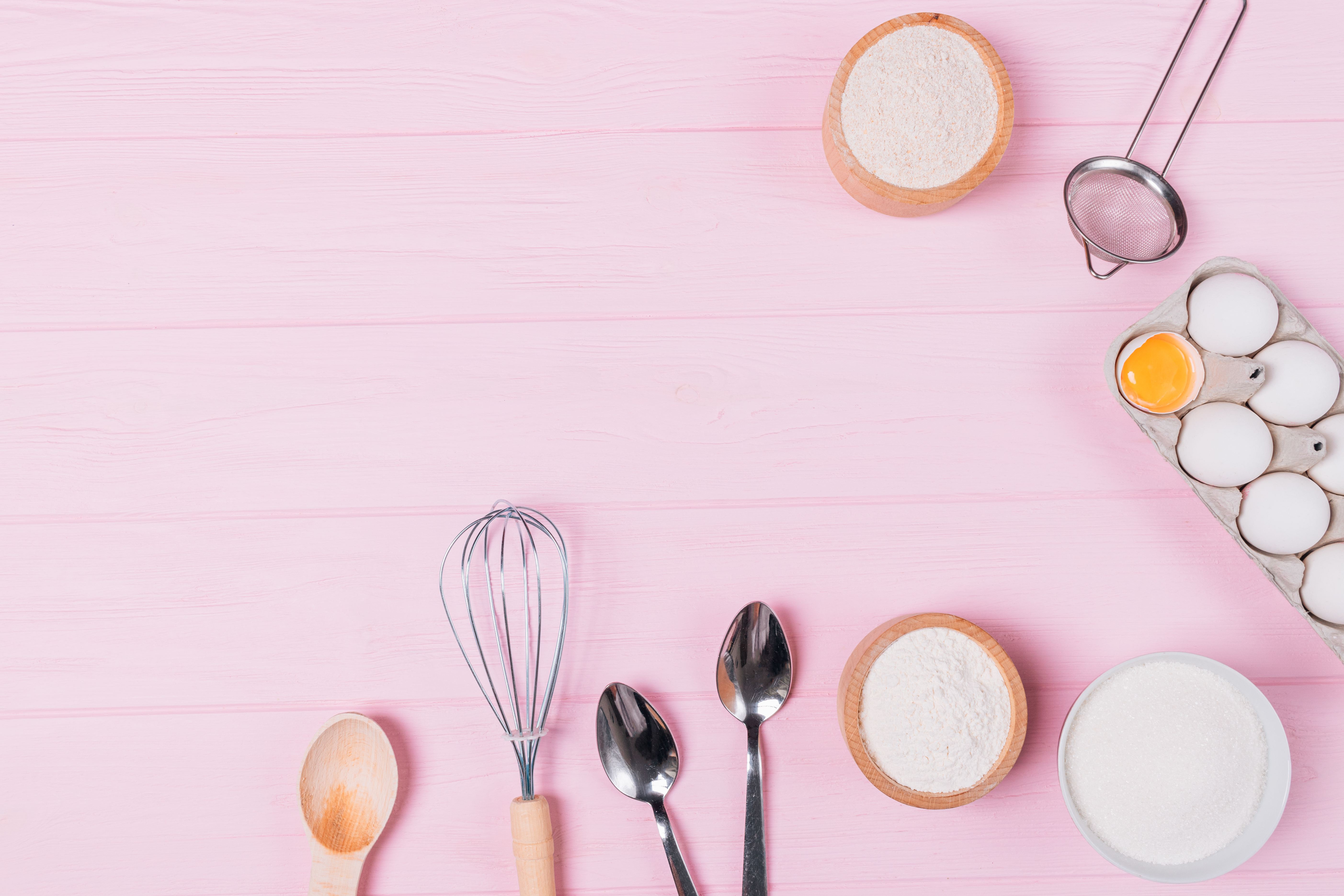 Baking Ingredients and Utensils on Pink Background